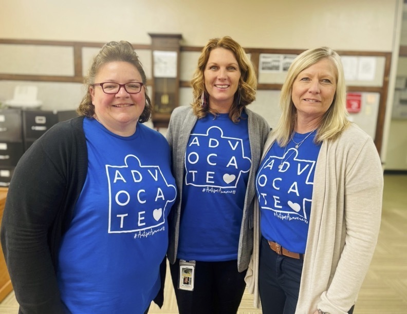 Staff wearing shirts designed by CIS